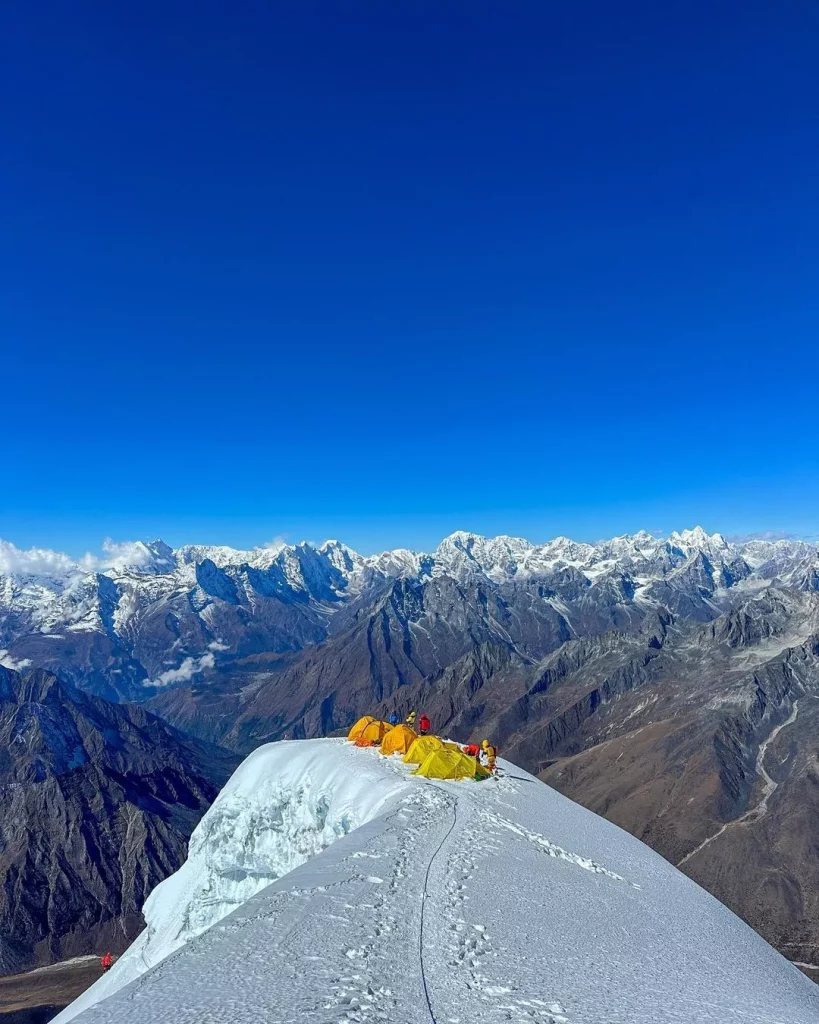 Lobuche Peak Climbing Nepal: Ultimate Guide for Beginners 2 a group of tents on a snowy mountain top