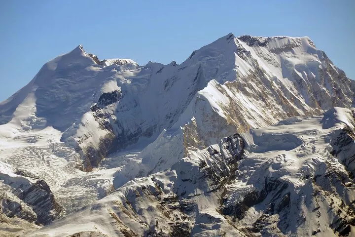 Ultimate Guide to Peak Climbing in Nepal: Top Peaks & Essential Tips 2 a snowy mountain range with blue sky